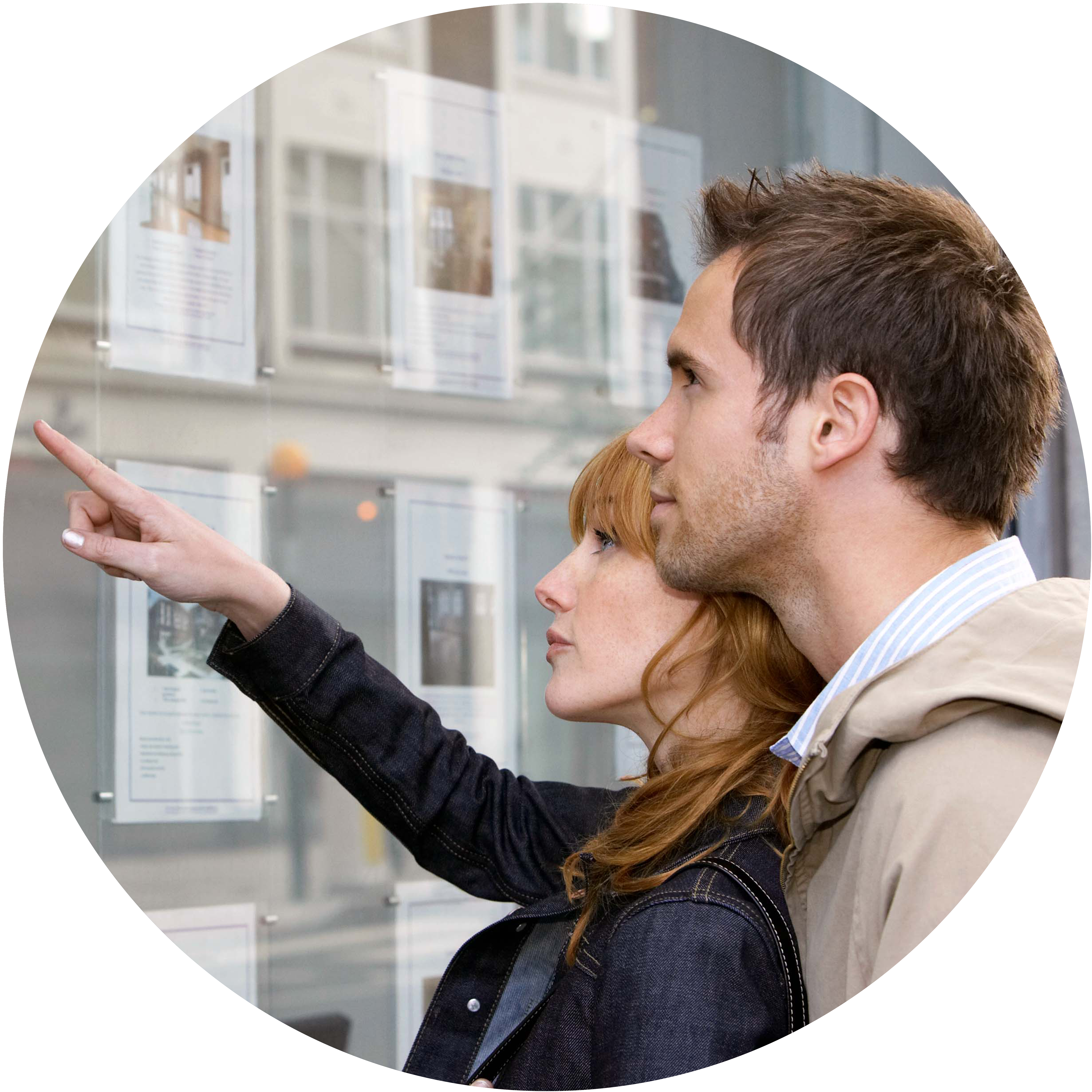Couple looking at possible estate agents to pick for their own property sale