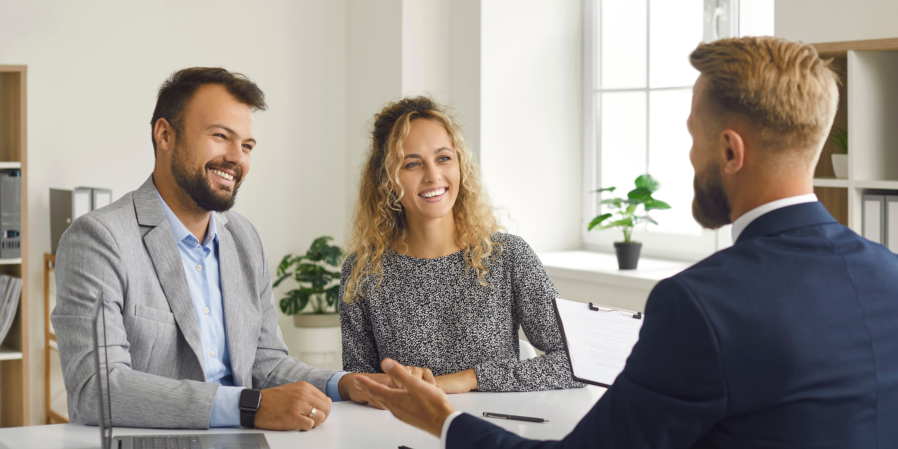 Couple speaking with broker